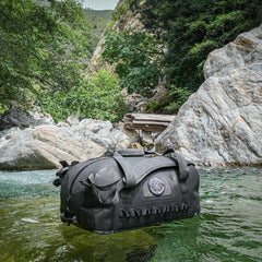 PDW All Terrain Duffel 45L floating on Big Sur River, CA