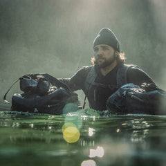 PDW All Terrain Duffel 45L floating with dude in British Columbia