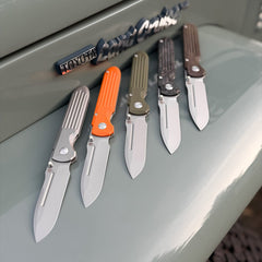 SPD Invictus-SP folding knives on Toyota Land Cruiser FJ43